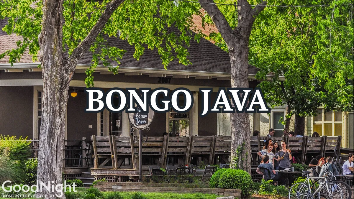 The exterior of Bongo Java, a popular Nashville coffee spot, with people relaxing at outdoor tables. The scene showcases a sense of community and relaxation, with a visible sign and seasonal decor, indicating a lively neighborhood with diverse local businesses.
